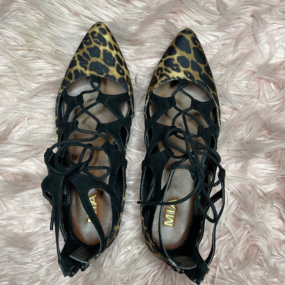 Size 8.5 leopard print, lace up/zipper back.